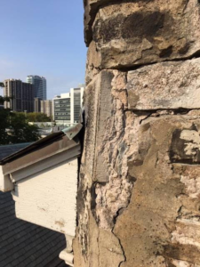 Close up view of southwest portion of church building needing repair